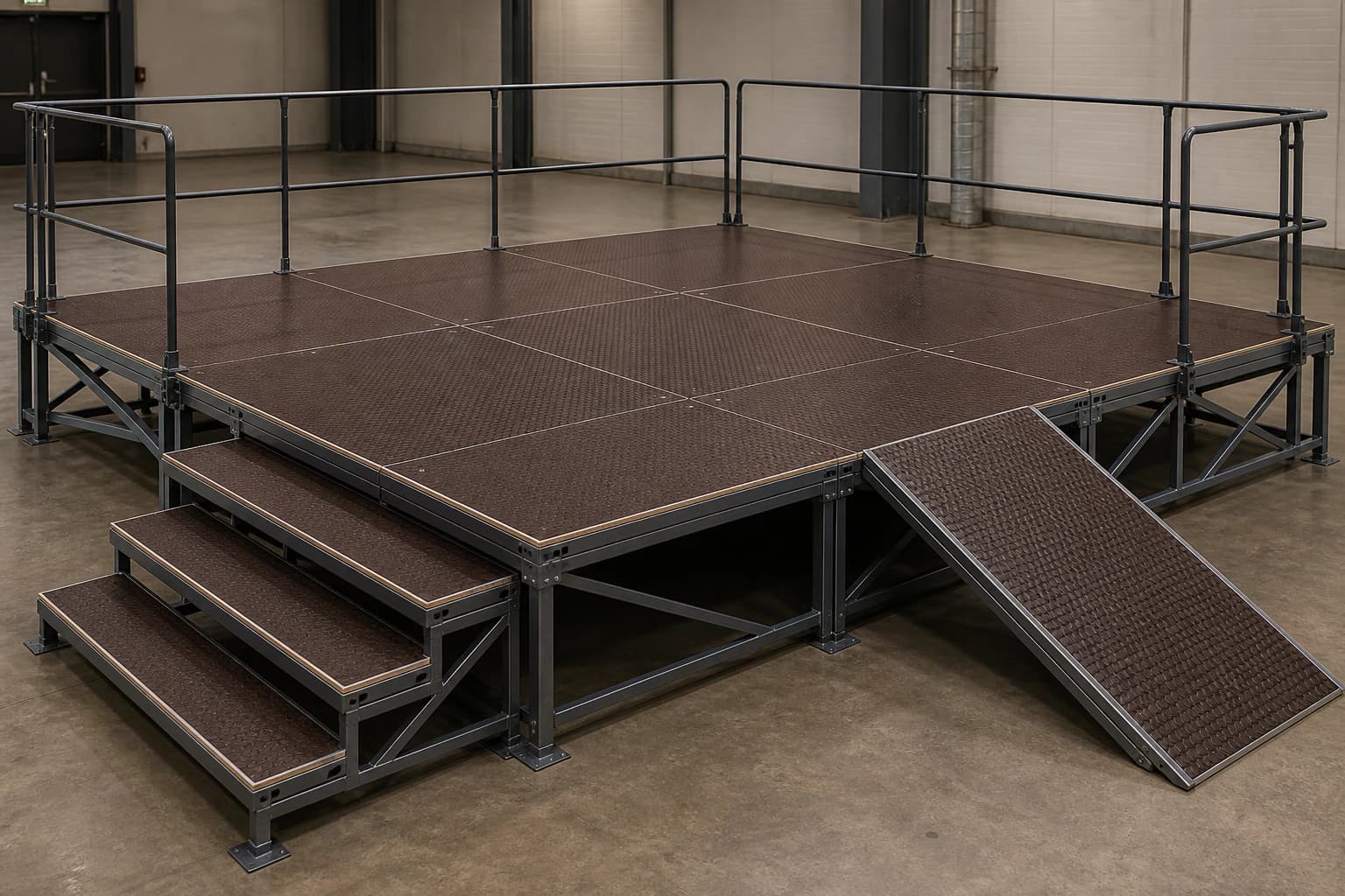 Modular steel stage with fully supported patterned plywood deck panels, three stair treads, a ramp and frame-mounted guardrails