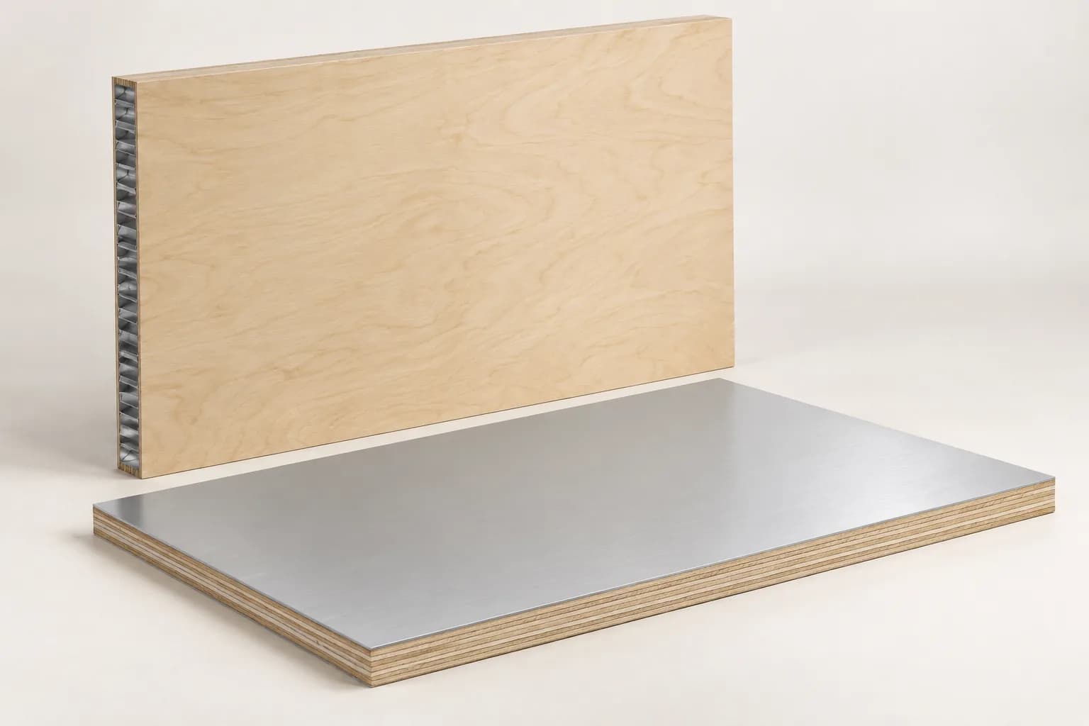 A plywood-skinned cellular-core panel beside an aluminium-faced plywood panel with visible cut edges